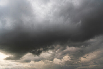 Dramatic dark storm thundercloud rain clouds on black sky background. Dark thunderstorm clouds...