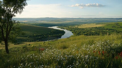 Green rolling hills and a meandering river under a soft sky with small clouds