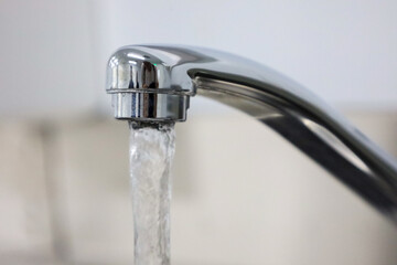 close-up of a stream of water coming out of a tap