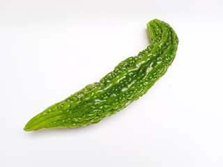 Close up of fresh green bitter melon isolated on white background. Healthy organic vegetable