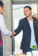 Vertical Businessman shaking hands together team partnership teamwork. Trust honesty business...