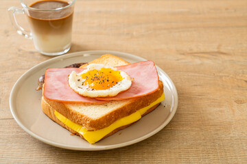 bread toasted cheese topped ham and fried egg with pork sausage