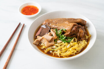 egg noodles with stewed and braised duck in brown soup