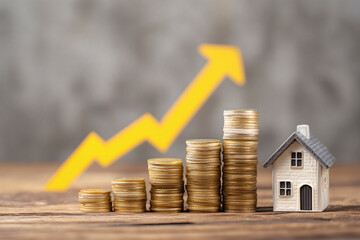 Rising Property Value: Stacks of coins symbolizing increasing home equity and a positive market trend.