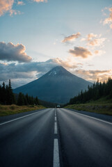 Asphalt road square and green mountain with sky clouds natural landscape at dusk. car background.