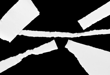 Strips of white ripped paper with ragged edges, isolated on black background, ripped paper,  paper scraps