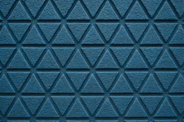 Abstract Triangular Pattern: A striking close-up showcases a mesmerizing geometric design of repeating triangles in a cool, textured hue, creating a modern and visually dynamic aesthetic.