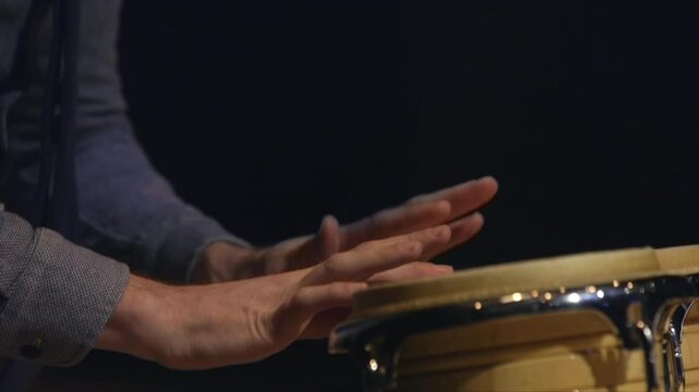 Musician hands percussionist playing drums bongo tomtom snare drum side drum