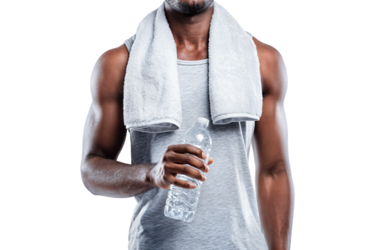 Fit man in sleeveless shirt holding water bottle with towel around neck after workout isolated on transparent background