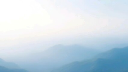 Soft Blue Mist Over Layered Mountains in a Tranquil Landscape