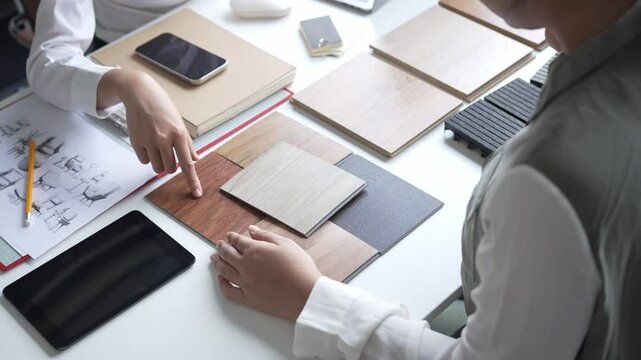 Interior Designer Consulting with Client on Material Selection