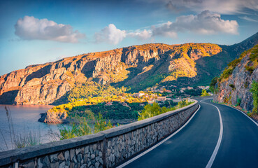 Splendid summer view of empty asphalt road to Acquafredda town. Wonderful morning scene of Italy,...