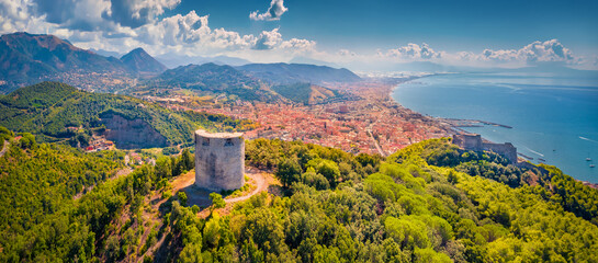 Panoramic summer view from flying drone of Bastiglia tower and Arechi Castle. Aerial morning cityscape of Salerno town, Italy, Europe. Traveling concept background.