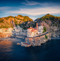 Exciting summer view from flying drone of Collegiate Santa Maria Maddalena church. Fantastic morning cityscape of Atrani town, Italy. Gorgeous  Mediterranean seascape. Traveling concept background.