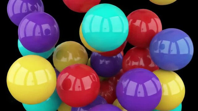 Colorful Glossy Balls Bouncing Against Black Background. Balls in motion bouncing from above