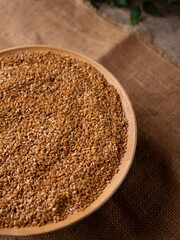 Organic golden flaxseed, linseed grains. Superfood high in fiber.