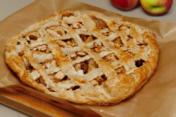 Homemade apple pie on dark rustic background, top view. Classic autumn dessert