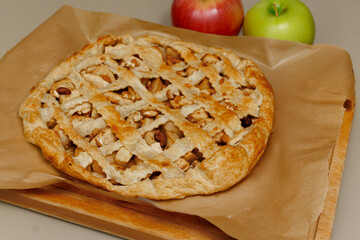 Homemade apple pie on dark rustic background, top view. Classic autumn dessert