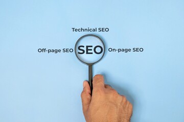 A magnifying glass with the letters "SEO". Search engine optimization concept.