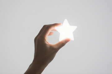 Hand Holding Glowing Star on White