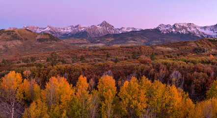 Dusk at Sneffels Range - Panoramic Autumn dusk view of rugged Sneffels Range, the northwest edge of the San Juan Mountains of Colorado Rockies, as seen from Dallas Divide, Ridgway, CO, USA.