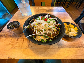 A bowl of warm Vietnamese pho served in a restaurant in South Korea.
