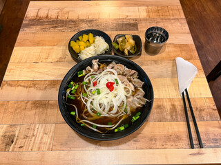 A bowl of warm Vietnamese pho served in a restaurant in South Korea.