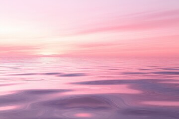 Obraz premium A beautiful pink ocean with a sunset in the background. A tranquil and serene water reflection can be seen under a soft pink sky at sunset.