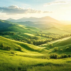 Obraz premium Lush green hills rolling to distant mountains under a golden sunset