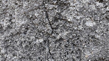 Grungy concrete wall texture with rough stone surface and vintage character, perfect for...