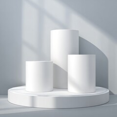 Three white cylinders on a circular platform, bathed in sunlight