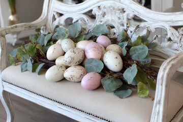 Elegant spring bench with pale pastel eggs
