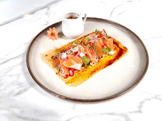 Thai spicy salmon salad with lemongrass and herbs. Japanese Thai fusion food. Salmon sashimi Thai...