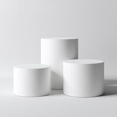 Three white cylinders on a light gray background