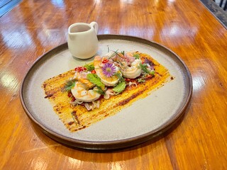 Thai spicy shrimp salad with lemongrass and herbs. Famous Thai food