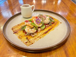 Thai spicy shrimp salad with lemongrass and herbs. Famous Thai food