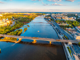 Warsaw old city center and skyscrapers in the background Vistula river. Sunset in Warsaw city center aerial view.