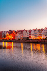 Fototapeta premium Gdansk with Motlawa river in Poland. Old town colourful house with Stragania Gate