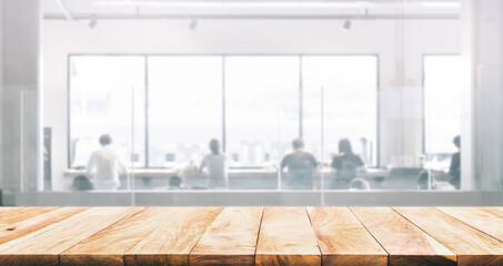 Counter top cafe bar,wood texture table with blur people sitting in modern working space.For decoration product display.