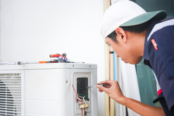 Repairman fix air conditioning systems, Male technician service for repair and maintenance of air...