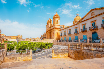 view in Noto, with the Basilica Minore di San Nicolo and Palazzo Ducezio, Sicily, Italy
