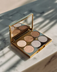 Luxurious eyeshadow palette with golden edges, featuring shimmering shades of gold, silver, and bronze. elegant design and reflective surface create stunning visual appeal