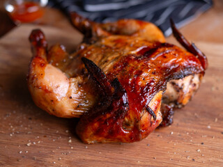 Whole Grilled Chicken on Wooden Table.