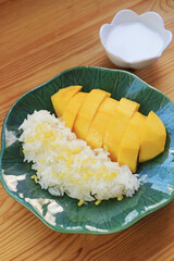 Plate of Famous Thai Dessert of Fresh Ripe Mango with Sticky Rice and Creamy Coconut Milk