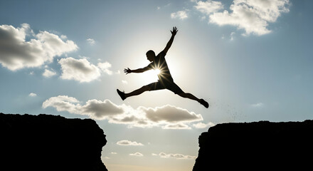 Man Jumping Cliff Silhouette Against Sky
