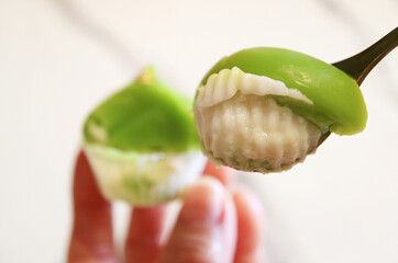 Two layered Kanom Piak Poon Bai Toey, Thai Pudding Blended with Pandan Leaf Juice with Creamy...