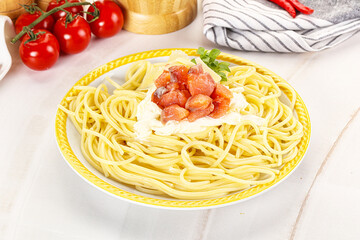 Pasta spaghetti with salmon and stracciatella