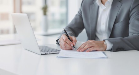 Businessman Signing Document at Desk