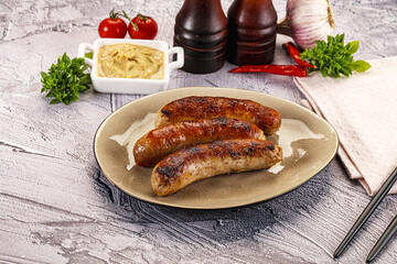 Delicous natural roasted sausages in the plate