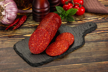 Spicy pepperoni sausages with sliced piece